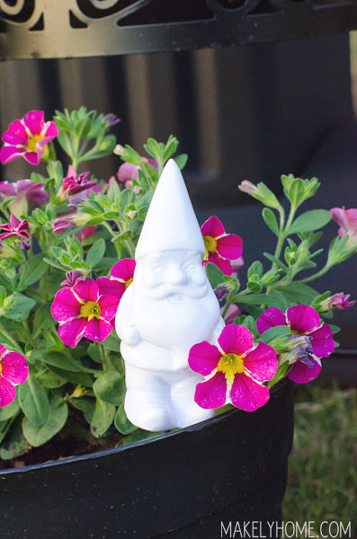Little gnome in a cute flower planter made from an upcycled BBQ grill via MakelyHome.com