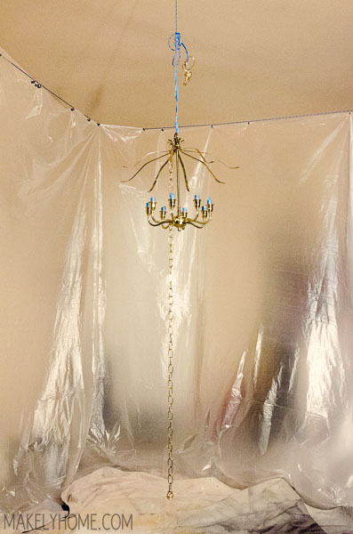 how to hang a chandelier for easy spray painting via MakelyHome.com
