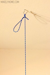 how to hang a chandelier for easy spray painting via MakelyHome.com